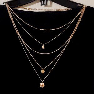 Multi layered gold tone necklace